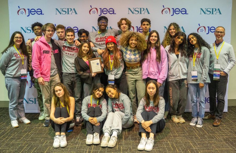 Members of the U-High Midway and U-Highlights pose for a group photo with a Best of Show second place award at the JEA/NSPA National High School Journalism Convention in St. Louis. 