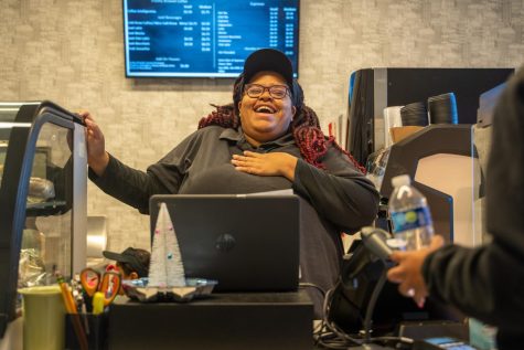 STRAIGHT FROM THE HEART. Ariel Williams laughs as she converses with a customer. Ms.  Williams keeps conversation flowing as she prepares drinks and hands out baked goods. Talking to her in the coffee shop has become a highlight of many people’s days.