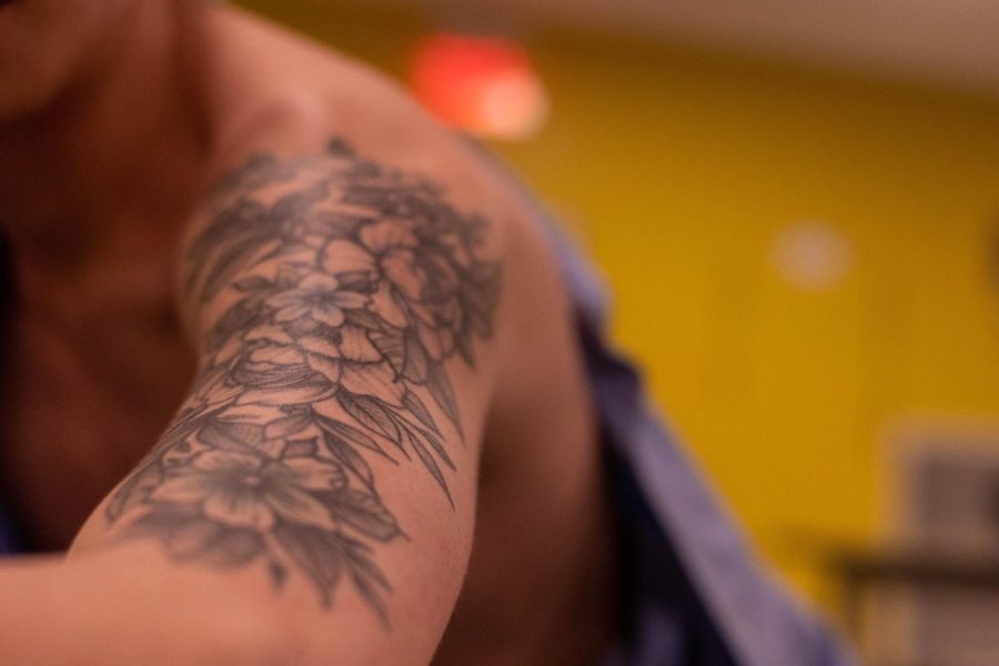 SLEEVE SECTION.  Despite being 17 at the time, senior Michael Pan was able to legally get a sleeve tattoo at a parlor in Indiana with parental consent. He chose to get flowers on his arm in tribute to his uncle in China.