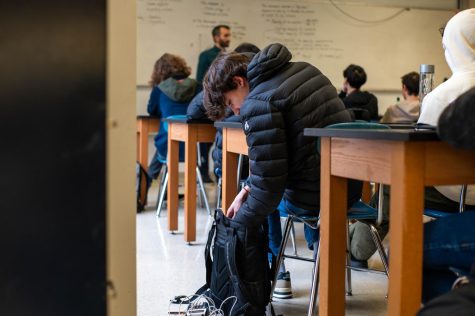 TIME CRUNCH: With only five minutes to get to their next class, it is common for students to pack up their supplies while a teacher is still talking.