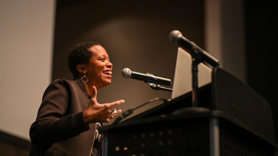 Chicago artist Amanda Williams, a 1992 U-High alumna, speaks at the ArtsFest Opening Ceremony on March 1. Centering her projects on the complex issues of race, Ms. Williams’ work is recognizable by its colorful appearance.  
