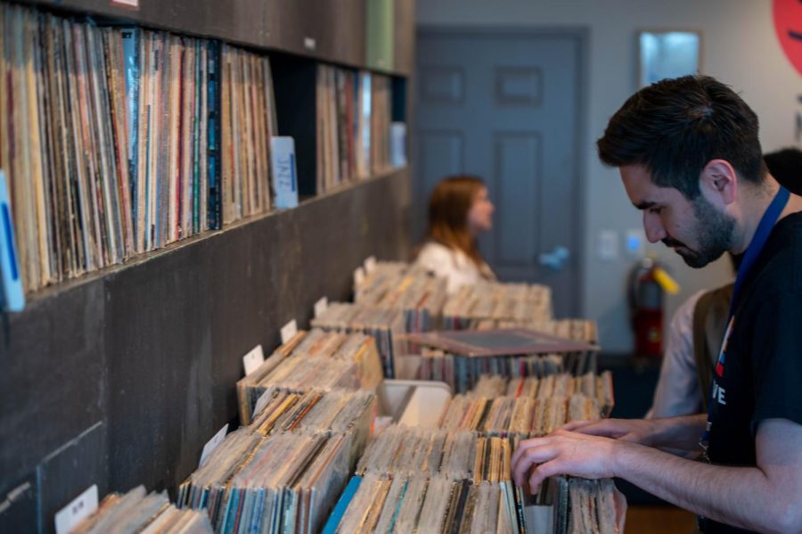 A customer digs through record bins at the opening event for Miyagi records on April 15th.