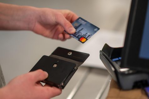 GIVE (YOURSELF) SOME CREDIT: When paying for an item, it's important to consider the costs and benefits of using a credit card or debit card.