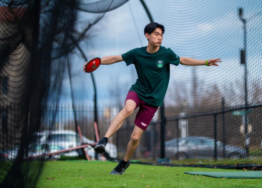 Junior Jace Chen practices the discus throw. This season, Jace has been working alongside Field Coach Brandon Davis who began working with the track athletes in January. 
