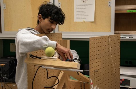 In a practice earlier this year, Science Olympiad member Aneesh Pushparaj works on a project.