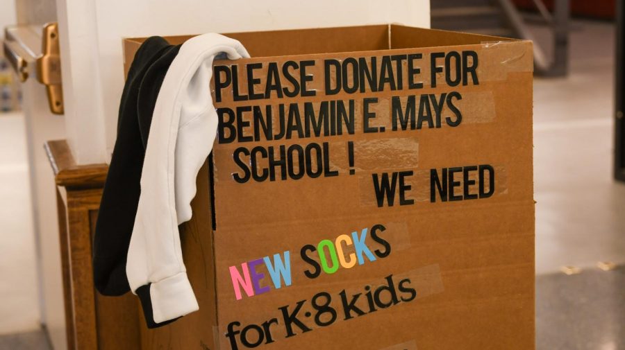 A box for the clothing drive sits in the high school lobby.