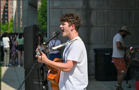 Junior Adam Syverson plays guitar for a crowd at Labstock, Student Council’s annual end-of-year celebration held by Student Council.