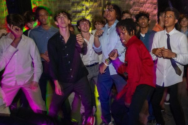 A group of students dance together in the Sherry Lansing Theater during homecoming on Sept. 23. The theme, A Night Out in Paris, was celebrated through both Student Councils decoration efforts and outfits worn by students.