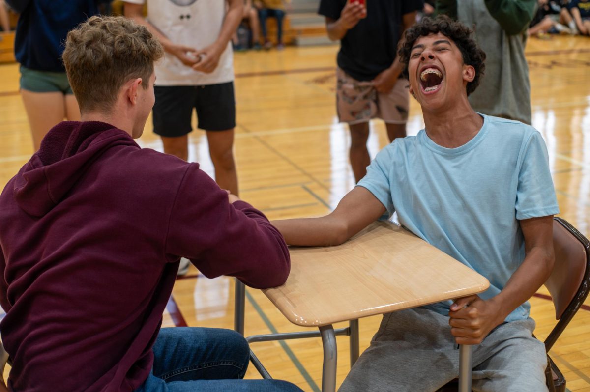Sophomore Ty Quiles shouts with passion after being defeated by senior Connor Booth in an arm wrestling match. After winning against Ty, Connor defeated juniors Zarak Siddiqi and Jeffrey Wang.