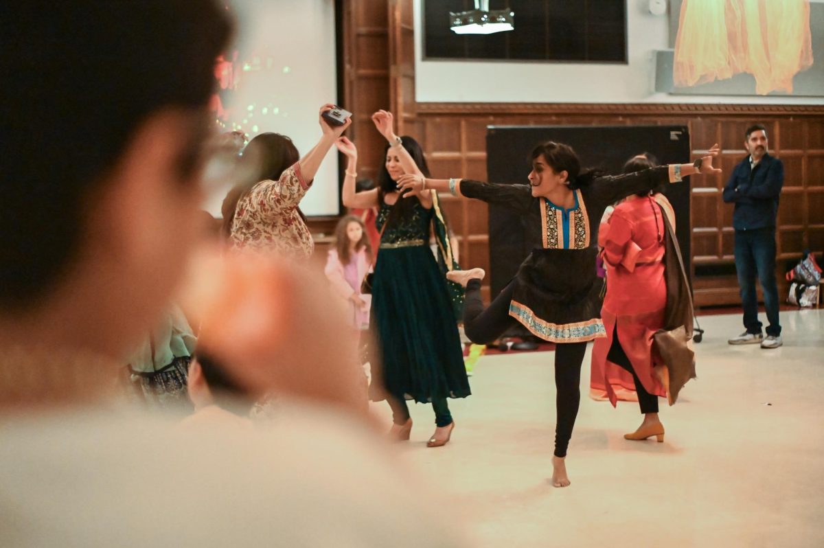 Attendees dance joyfully during the Diwali celebration on Oct. 13 in C-116. The celebration also included a complimentary dinner buffet of traditional delicacies.