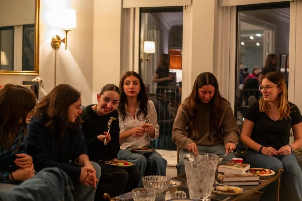 A group of Argentinian exchange students eat dinner at a farewell party hosted by Lab senior Hannah Shubin. During their two week visit to Chicago, twenty exchange students experienced Lab and explored Chicagos unique culture, through excursions such as museum visits and an architecture tour.