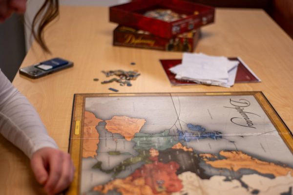 Many students have put down their devices and opted for long-term strategic tabletop board games.