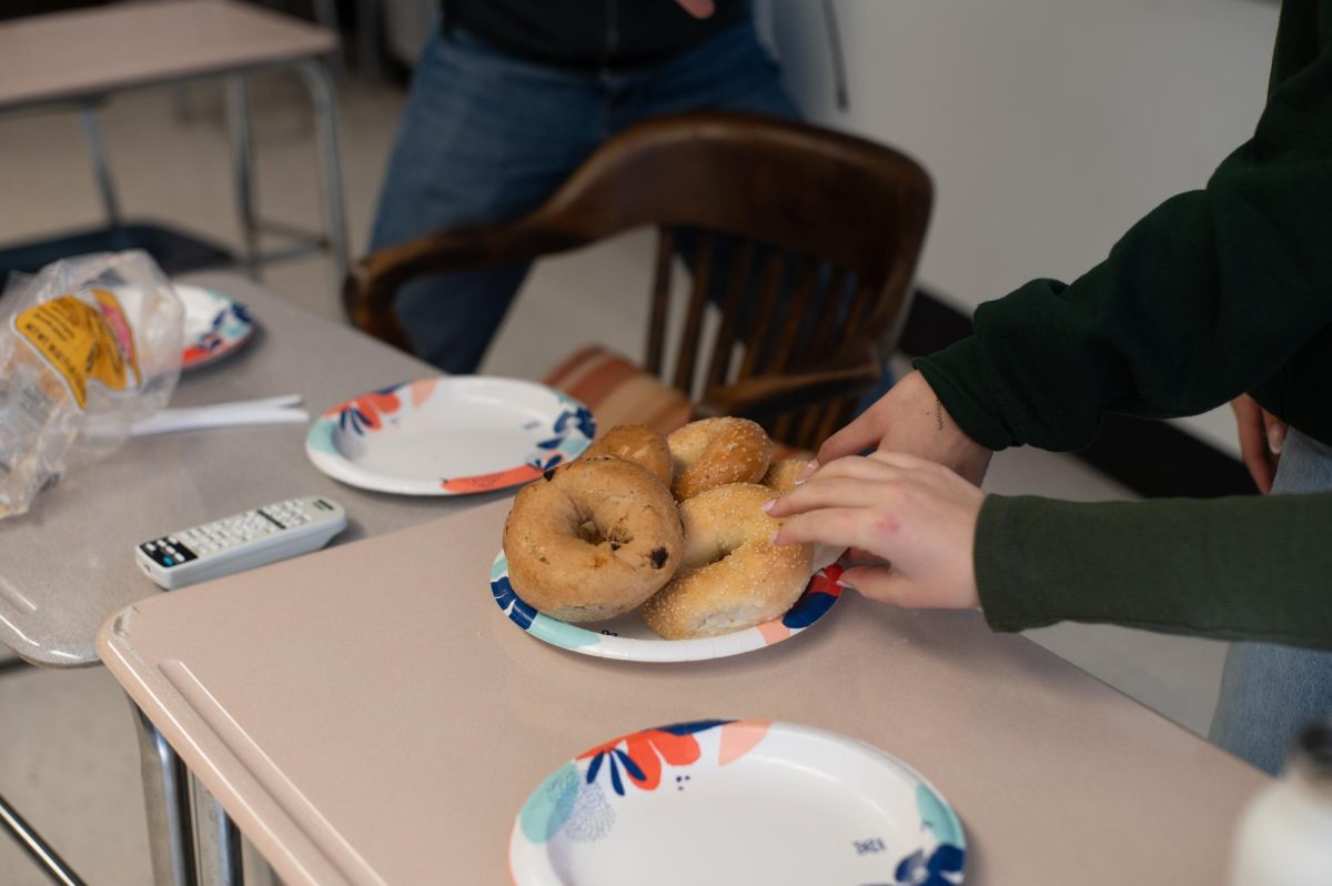 Students take bagels at Jewish Students’ Association club, where bagels are offered every Friday. Food plays a crucial role in many clubs in a range of ways, from attracting members to raising money.