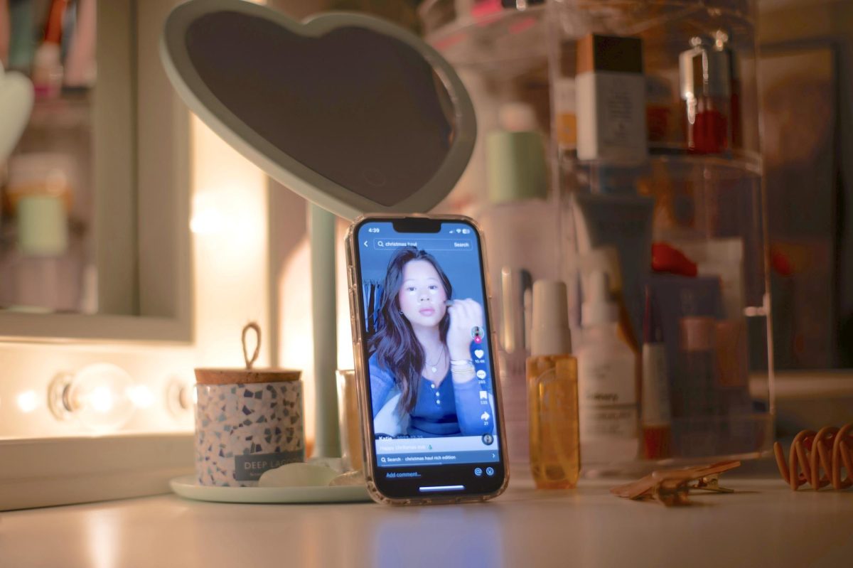 On a vanity, amid cosmetic products, a TikTok get ready with me video plays. In these confessional videos, influencers get honest and vulnerable with their fanbases. 