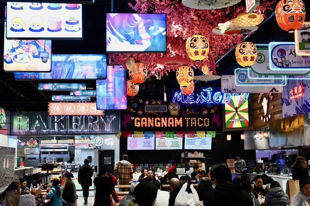 The neon signs and lights illuminate the seating area of Chicagos new Gangnam Market. 