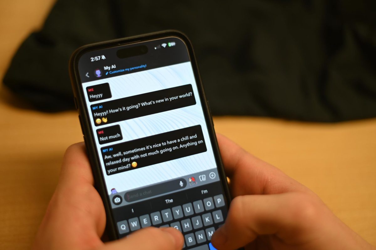 A student uses the artificial intelligence feature on snapchat. While the new resource initially piqued curiosity for students, it has become a nuisance for many.