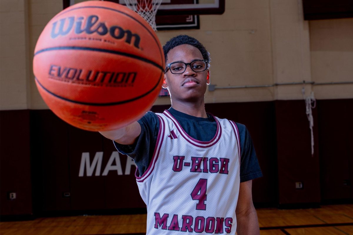 Bomi Johnson played as a double-rostered player on both JV and varsity for the first month of this basketball season but was moved up to only varsity when he showed consistent improvement.