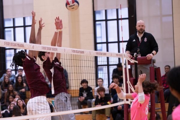 The varsity volleyball team defeated the boys varsity soccer team 21-8 on Feb. 26 in a charity game, with proceeds benefiting the Side-Out Foundation, a group in support of breast cancer patients.
