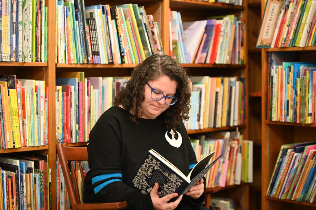 Lori Petrie, bookseller at 57th St. Books, enjoys her job and interacts with customers. She loves the comfort of the bookstore and brings warmth to all who walk in. 