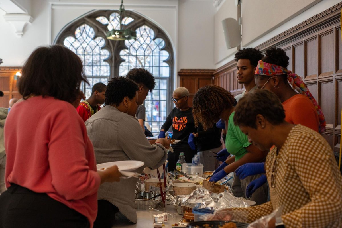 Community members gather at the Blacksgiving event, a Nov. 9 Thanksgiving-inspired cultural food exchange hosted by the Black Students Association in Judd C116. Inside and outside school, the popularity of identity-focused clubs has increased in recent years. BSA is only one of the many clubs of this kind available to students at Lab.