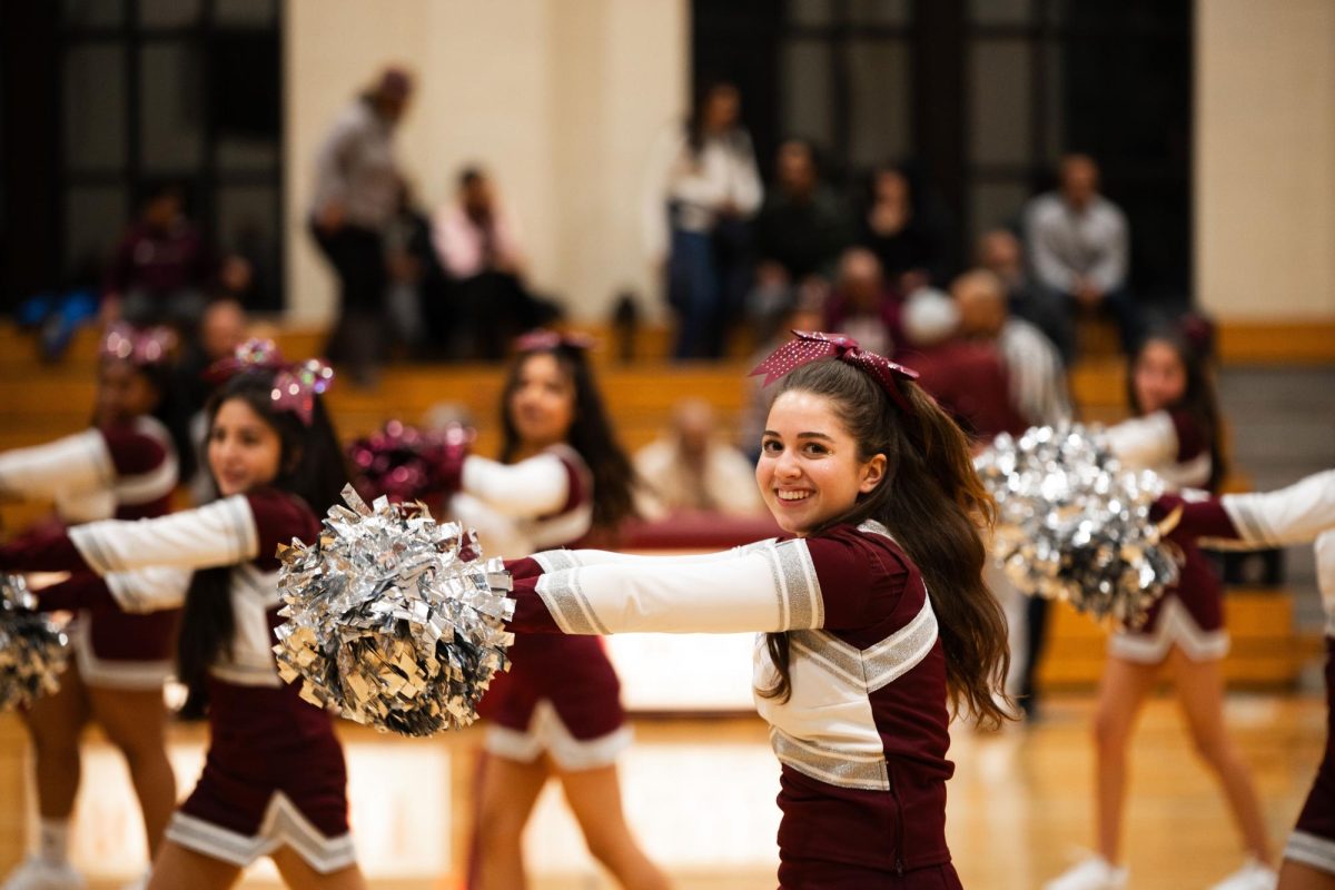 Sophomore Ceci Siegel leads the Dance Team in choreography during the basketball halftime show in Upper Kovler Gymnasium on Dec. 14. The Dance Team performed both at basketball games as well as in dance competitions.