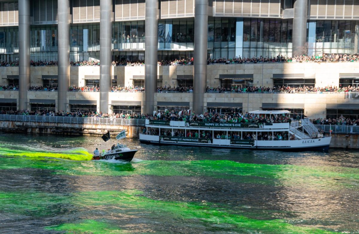On March 16, a large crowd watches the Chicago Plumbers Union dye the Chicago river green to celebrate St. Patrick’s Day, an annual tradition since 1962.