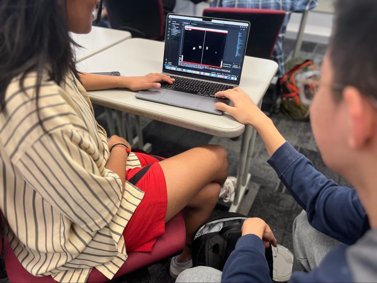 AI-ASSISTED+AMUSEMENT.+In+their+Machine+Learning+class%2C+sophomore+Vedika+Dangi+and+junior+Jeffery+Wang+play+a+pong+game+created+by+Vedika.+Students+were+allowed+to+use+assistance+from+ChatGPT+for+their+projects.+%E2%80%9CWe+wrote+the+majority+of+the+code+ourselves%2C+and+we+used+ChatGPT+to+finish+up+and+answer+any+remaining+questions+that+we+had%2C%E2%80%9D+Vedika+said.%0A%0A%0A
