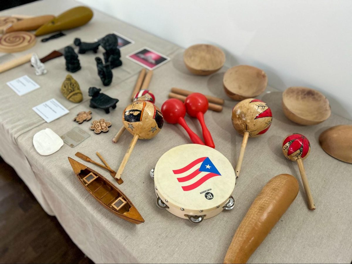 TRADITIONAL TEMPO. Taíno instruments from the National Museum of Puerto Rican Art and Culture’s Taíno Vive exhibit rest on a display table at the front of the exhibit on the second floor. The instruments present at the museum included maracas and guïro as well as replicas of the traditional boats and bowls of the Taíno people. 
