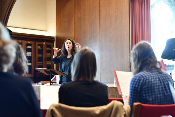 Director Mollie Stone conducts the Chicago World Music Chorus at their rehearsal at Fulton Hall on the University of Chicago campus on April 14. Music from many cultures is covered such as Swedish and Gospel. “In any of those languages or dialects, we can still honor the tradition,” member Sarah Elizabeth said. 