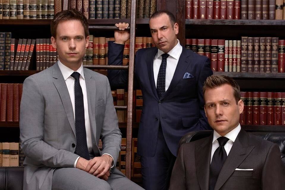 “Suits” stars Patrick J. Adams as Mike Ross, Rick Hoffman as Louis Litt, and Gabriel Macht as Harvey Specter stare into the camera in concentration. The show was the most-streamed TV show in 2023 after a resurgence in popularity, four years after the final season premiered in 2019.