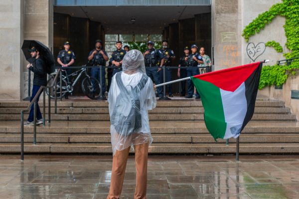 On May 2, the fourth day of the encampment, a demonstrator stands in front of a group of police waving a Palestinian flag. On Monday, April 29, UChicago United for Palestine launched an encampment on the University of Chicago’s Main Quad to stand in solidarity with the Palestinian people. The encampment and pro-Palestinian protests continued for days.