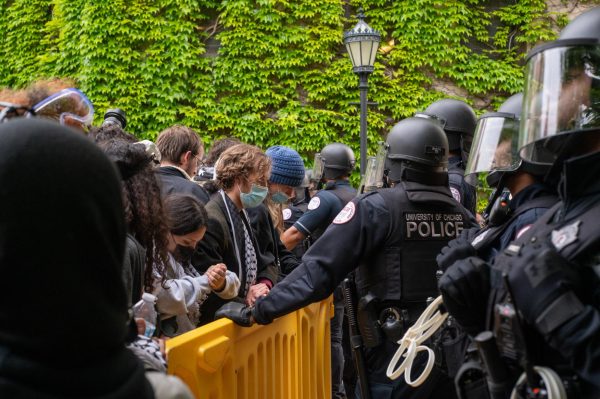 University of Chicago police officers hold a barricade on the Ellis Avenue entrance to the Main Quad on the morning of May 7 after police shut down the eight-day pro-Palestinian encampment on the Main Quad.