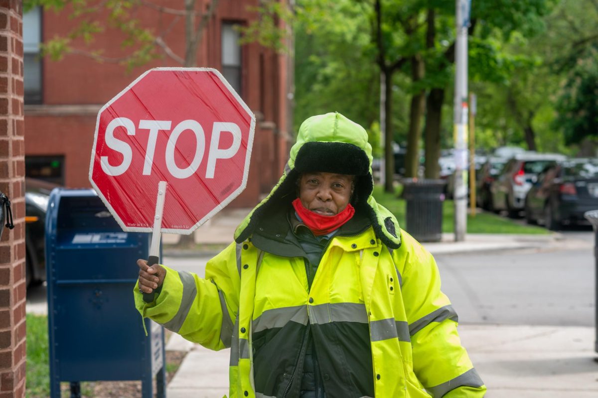 COMPASSION AND CARE. Tanya Sullivan, a crossing guard who works outside Ray Elementary School, considers interacting with kids as the highlight of being a crossing guard. “You learn a lot from meeting kids from many different schools,” she said, referring to the diverse group of students she encounters daily. 
