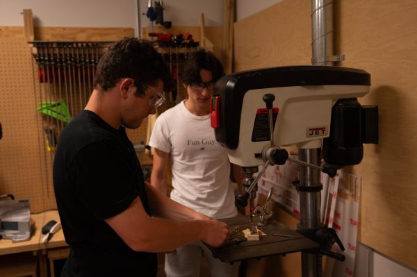 For their group’s May Project, seniors Adam Syverson and Luca Todorov work together to build a go-kart in the wood shop.