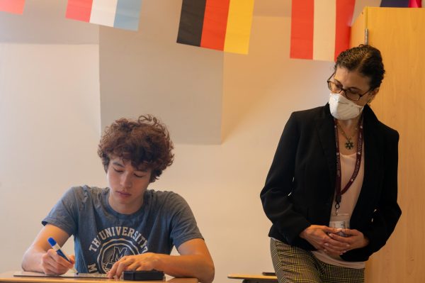  In a German 5 class, junior Oliver Go works with teacher Marianne Zemil. The news that Lab’s German program will be phased out sparked communitywide protests and other reactions. 