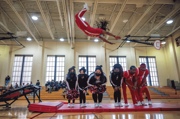 FLYING HIGH. During the 2022 ArtsFest opening ceremony, Dance Team members participated in a trick alongside the Jesse White Tumblers. 