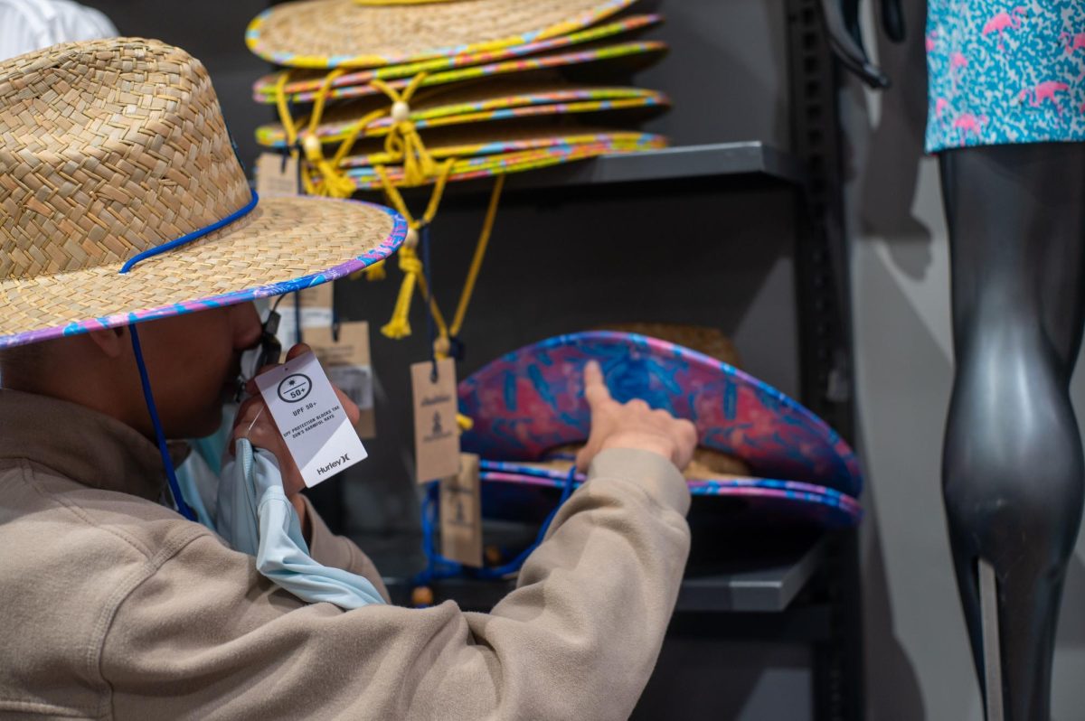 SUN SAFETY. A student explores the different summer sun protective gears available at REI. The demand for these summer gears has increased as concerns over excessive sunlight exposure continue to grow.