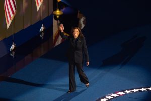 Vice President Kamala Harris waves to the crowd at the United Center as she enters the stage for her historic and much-anticipated nomination acceptance speech on Aug. 22, the fourth night of the Democratic National Convention.