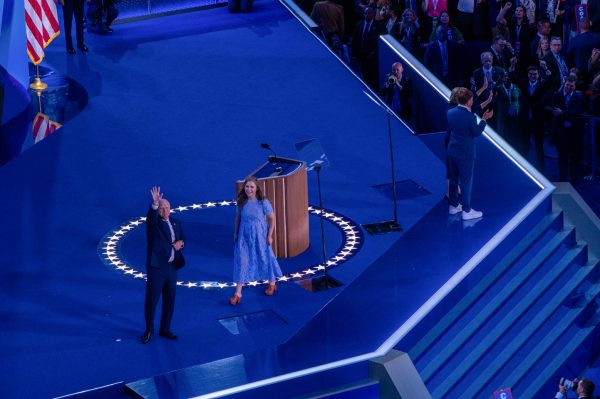 Vice Presidential candidate Tim Walz, Minnesota Governor, tearfully waves to the crowd after accepting the nomination Wednesday, Aug. 21, at the United Center. In his speech, he thanked his former students, describing how before his first campaign for Congress in 2006, they returned an important lesson he hoped he had taught them: “the belief that a single person can make a real difference for their neighbors.”