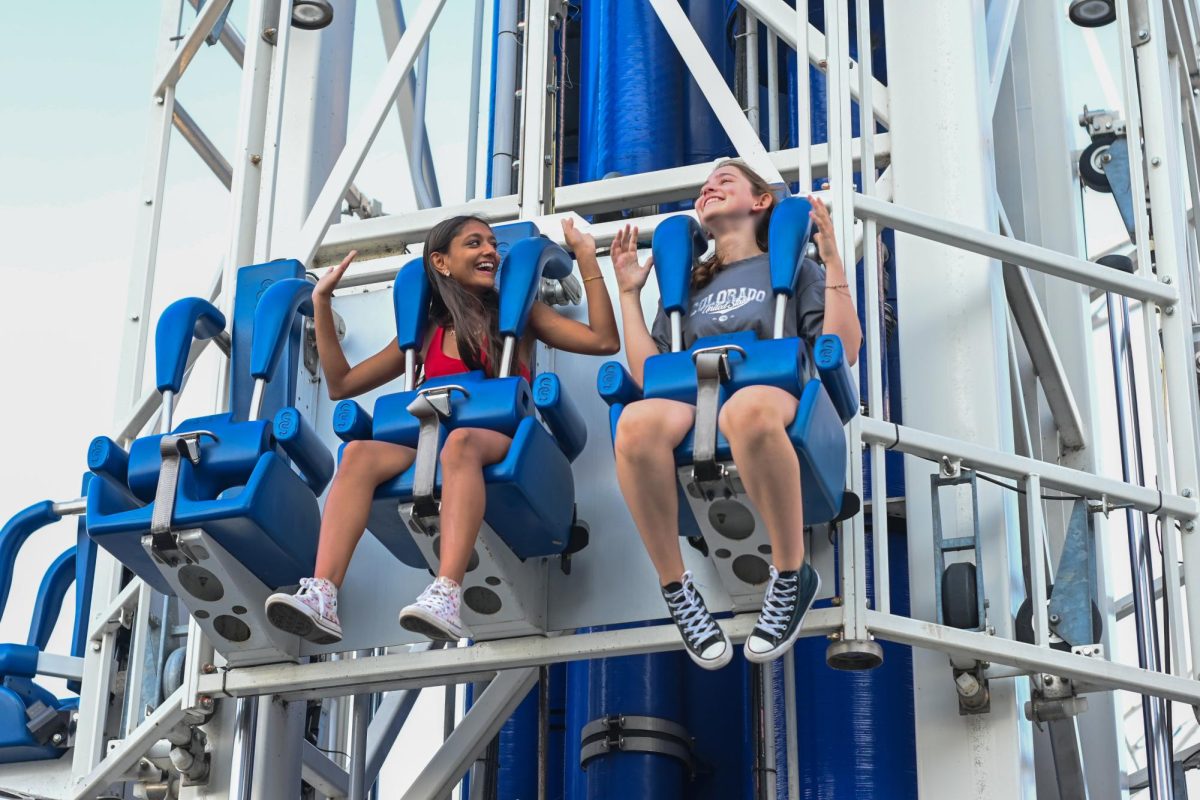 Junior Mihika Prakash and her exchange student Deva Martinez laugh on a rollercoaster on a trip to Six Flags.