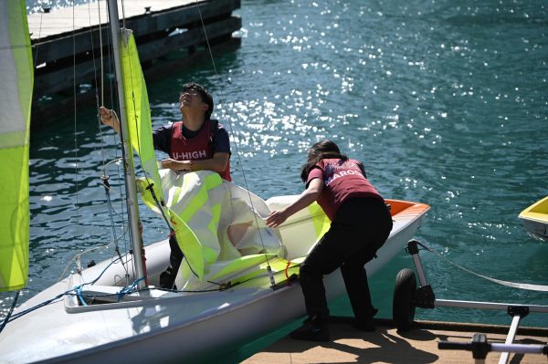 Ray Han and Sophie Li prepare their boat for a sailing practice last Spring. Clubs and departments are addressing changes and adapting in light of new, smaller budget cuts.