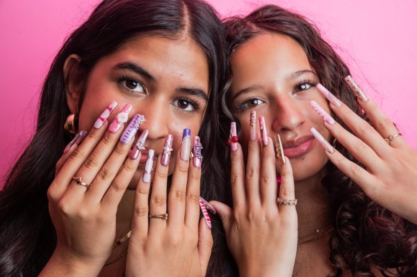 SET FOR SUCCESS. Sophomore nail artists Rania Khan and Mercury Romero pose with their custom nail sets. They've navigated the ins and outs of running their business, Shimmr, over the past few months, and have a loyal following.