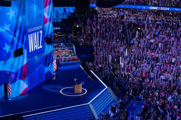 Vice presidential candidate and previous educator Tim Walz addresses his supportive crowd at the 2024 DNC.