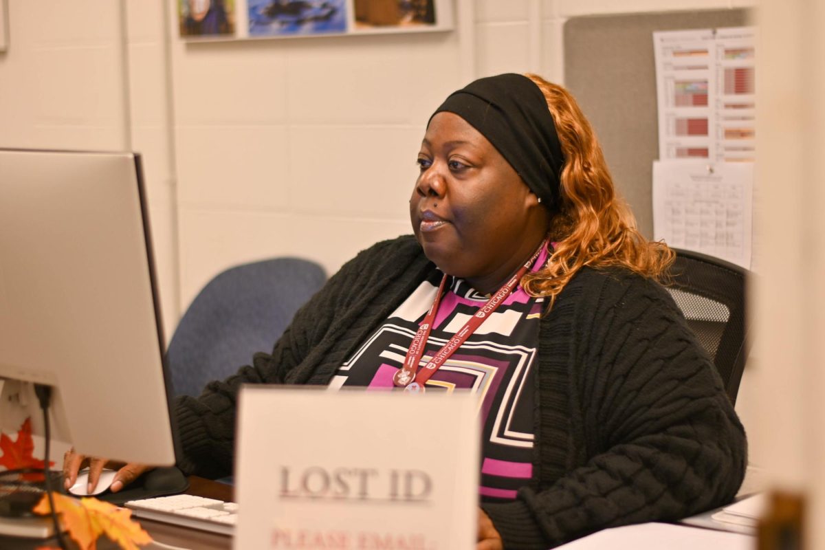 Kimmerly Hayes, U-High's new attendance project assistant, works at her desk in the high school dean's office. She began the role on Oct. 16.