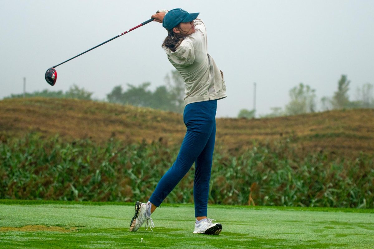 Senior Maxine Hurst follows through on a drive at golf competition earlier in the season. The girls golf team placed third overall at the IHSA 1A State 