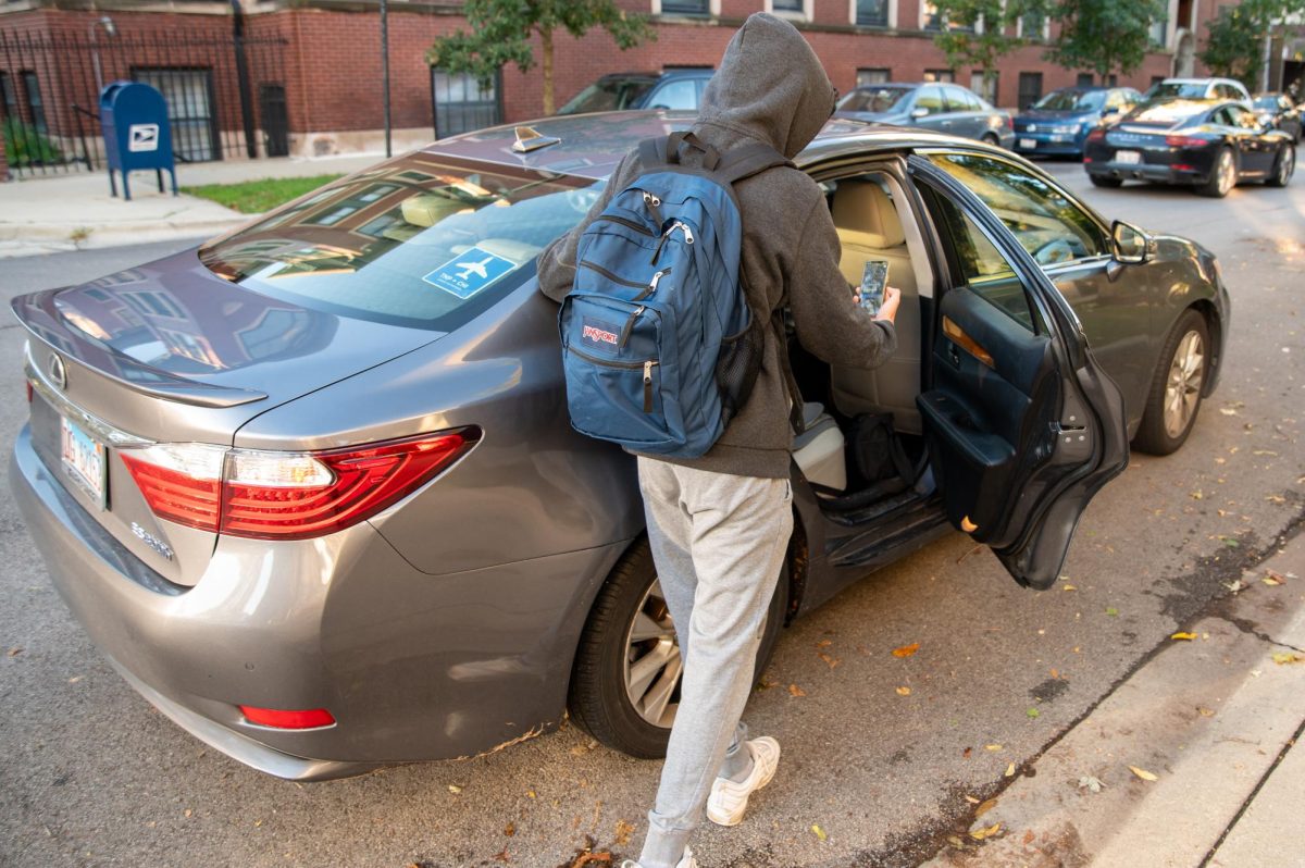 TRUSTED TRANSIT. Senior Joonsung Kim gets into his Uber on the corner of South east View Park and East 54th Street.