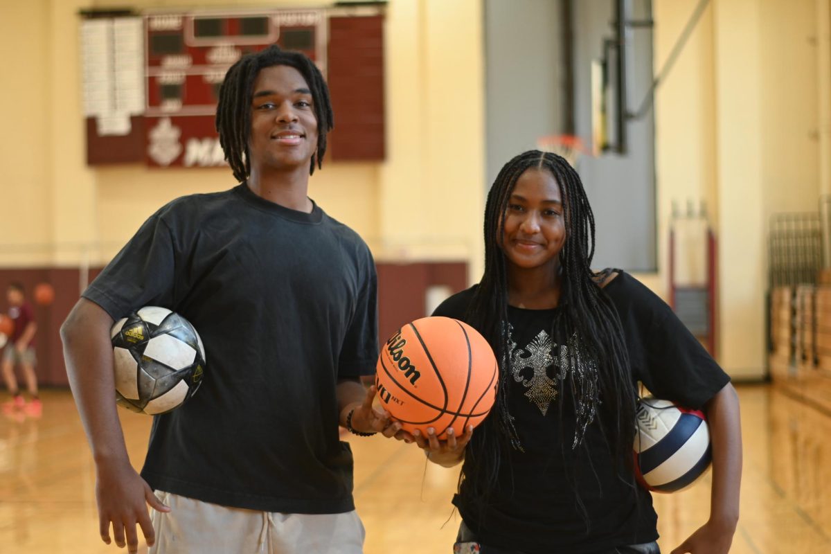 Seniors captains Noah Hoereth and Juliana Walker stand in Upper Kovler, representing their roles as leaders on the soccer, volleyball and basketball varsity teams.