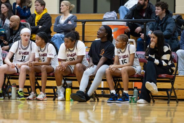 Sophomore Nanak Ofori-Mante cheers for the varsity girls basketball team. Nanak is one of multiple team members to be injured during the season, after she hyperextended her knee and tore her meniscus during the 2023-24 varsity girls basketball season.