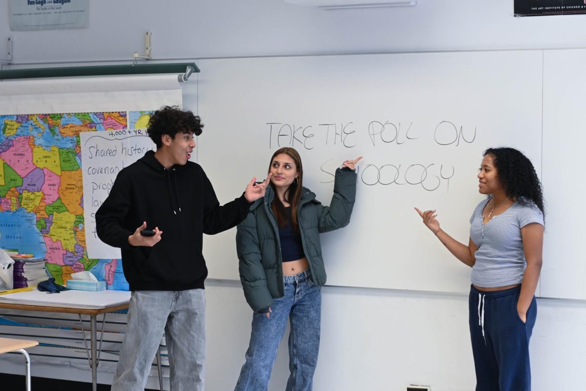 Juniors Anaya Douglas, Frankie Bishop and Ty Quiles converse during a meeting of the Multicultural Students Association. The number of clubs at U-High has increased as students create communities serving their different interests. 