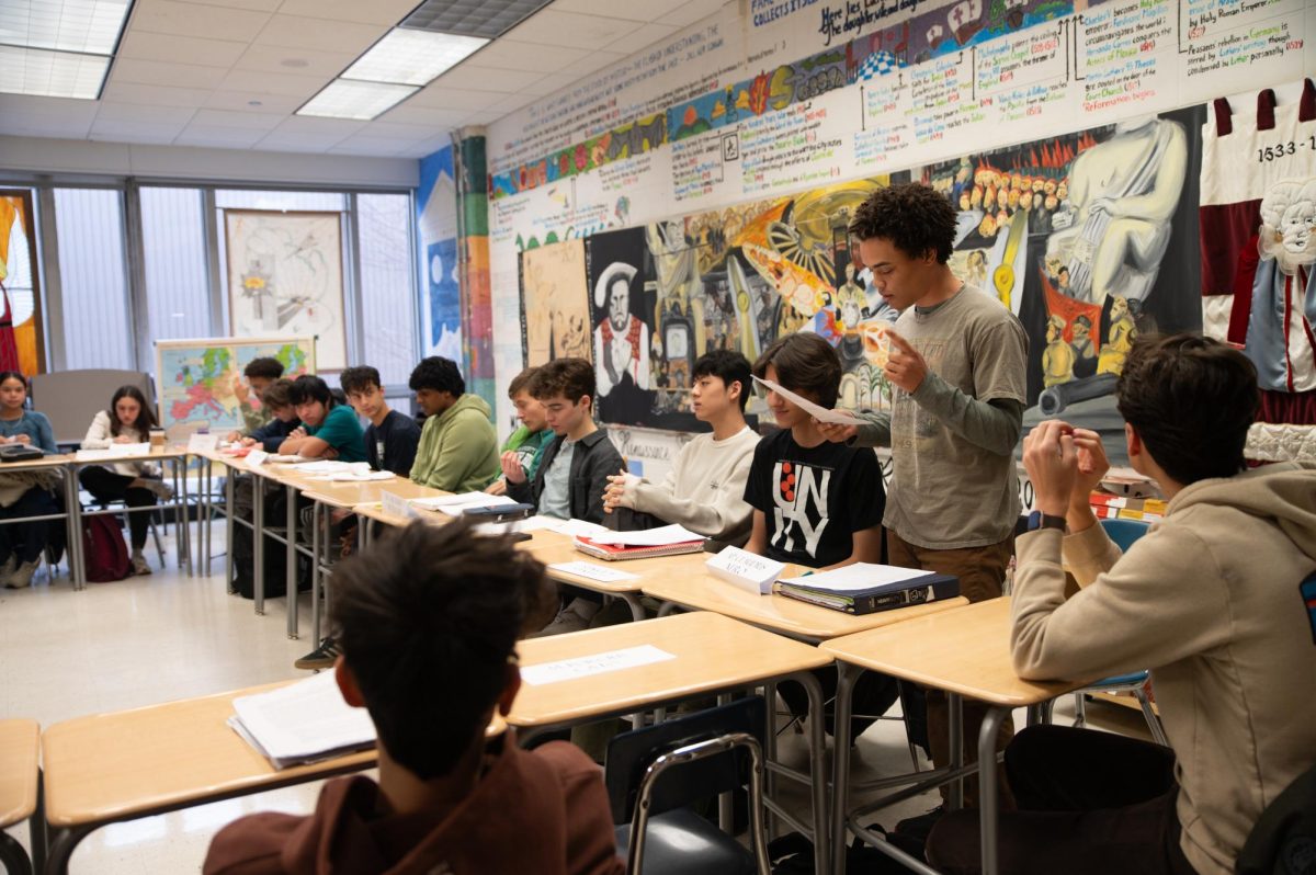 Senior Asa Bordelon addresses his AT War and Violence I history class in a historical simulation of the ancient Roman Senate Jan. 23. In the activity, organized by teacher Gabriel Baker, each student played the role of a Roman senator and explored the dynamics of this environment through collaboration and competition.